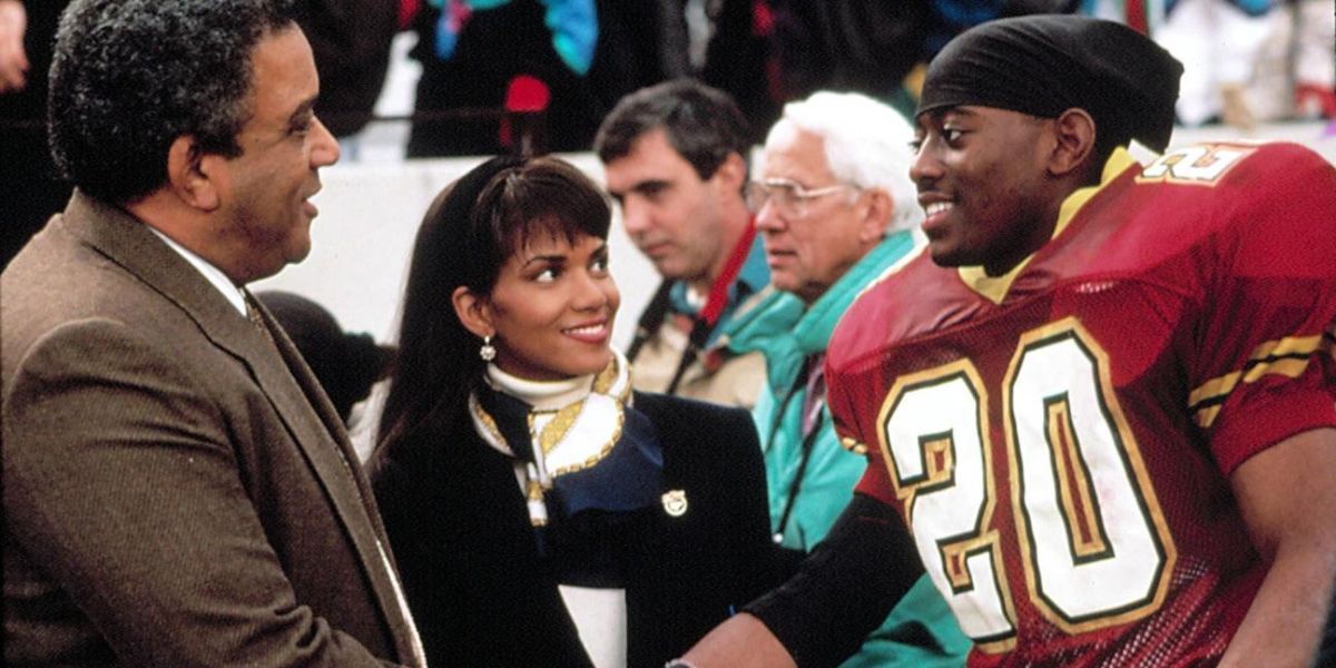 Football player shakes hands on the field in The Program (1993)