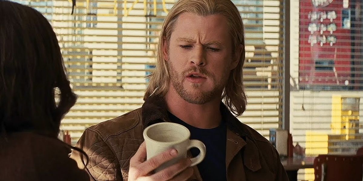 Chris Hemsworth as Thor holding a cup about to smash it