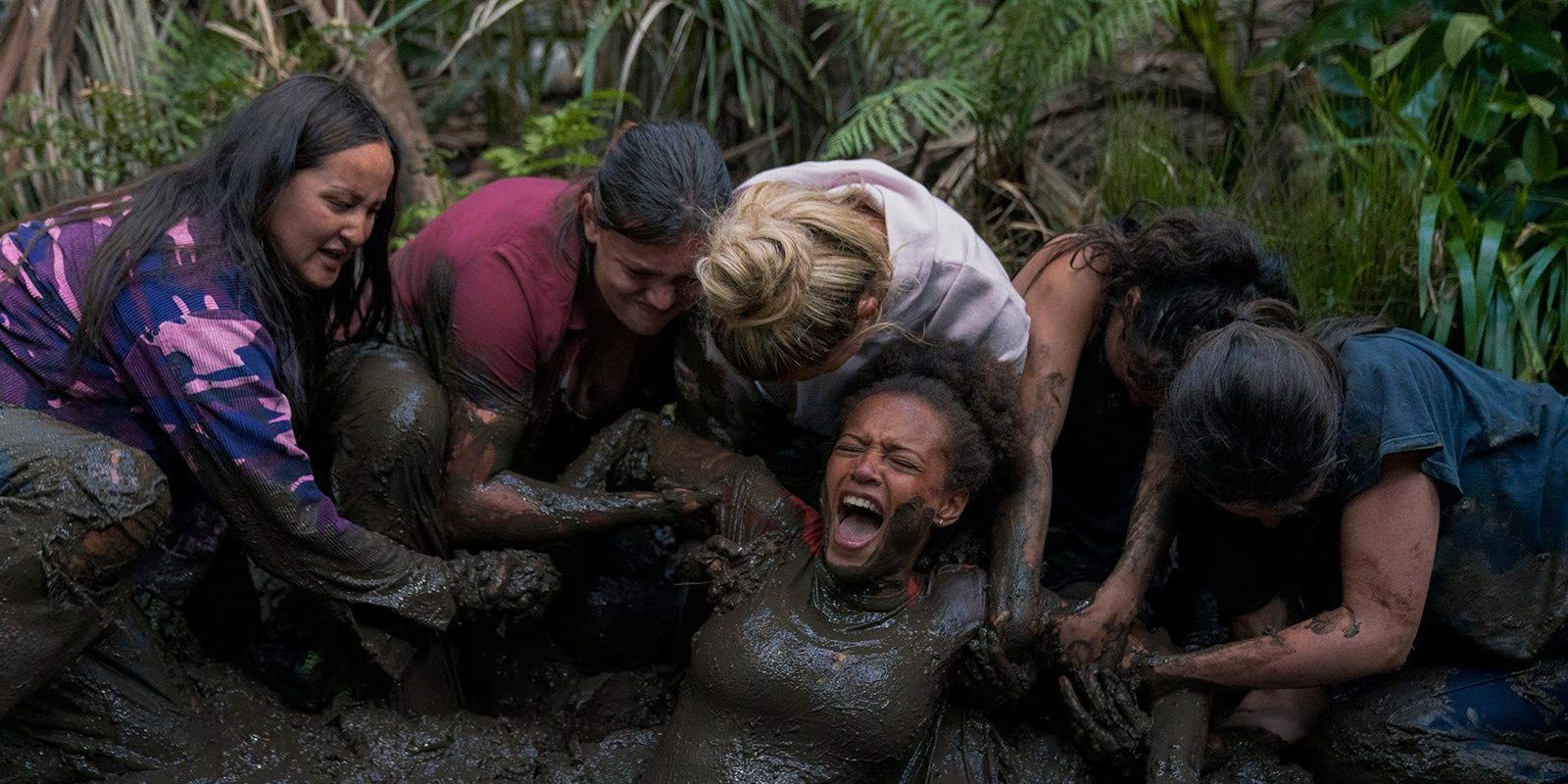 Wilds Girls help Rachel get out of the mud