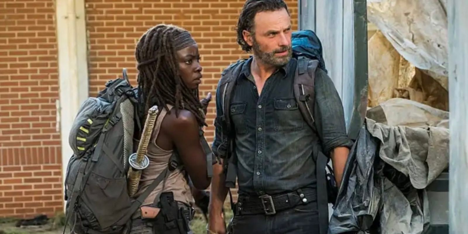 Rick and Michonne turn their heads to look out