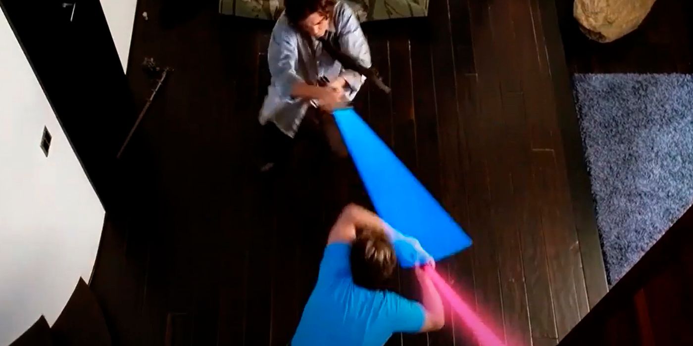 Zac Efron as Mike ODonnell Gold and Thomas Lennon as Ned Gold having a lightsaber fight in 17 Again