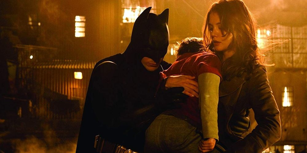 Batman and Rachel rescue a boy in Batman Begins
