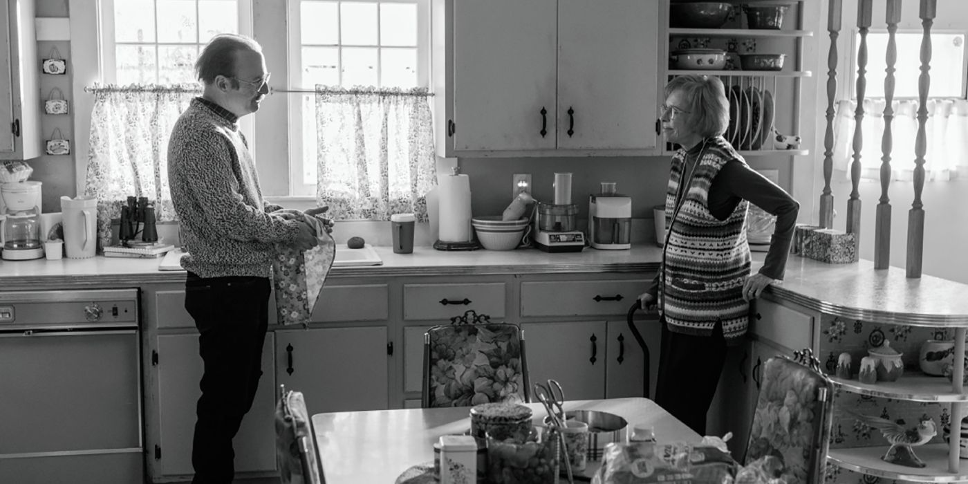 A black and white image of Gene and Marion talking to one another in her kitchen in Better Call Saul.