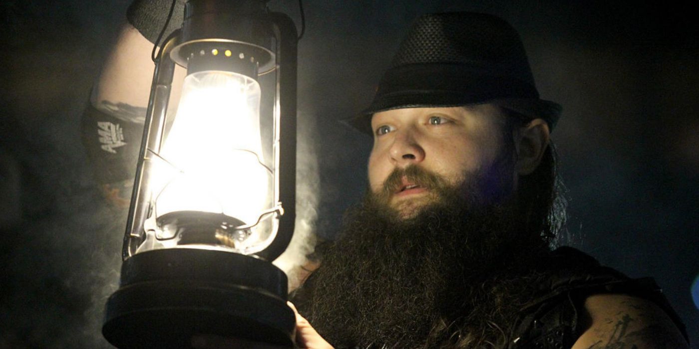 WWE's Bray Wyatt holding lantern.