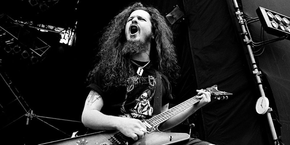 Dimebag Darrell plays onstage at a Pantera concert