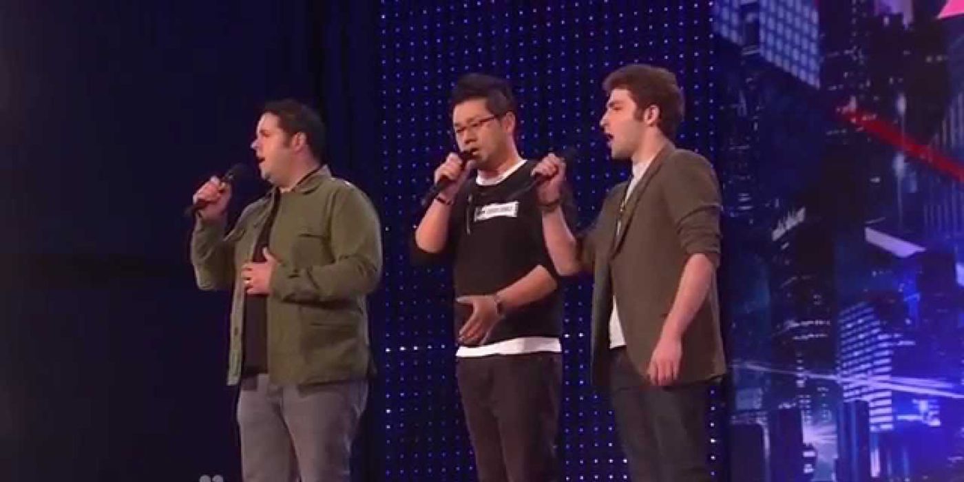 The three men who make of Forte on stage singing into mics on AGT.