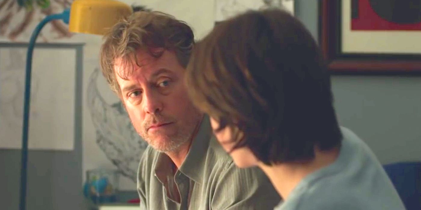 Greg Kinnear sitting down talking to his young son in a scene from Little Men.
