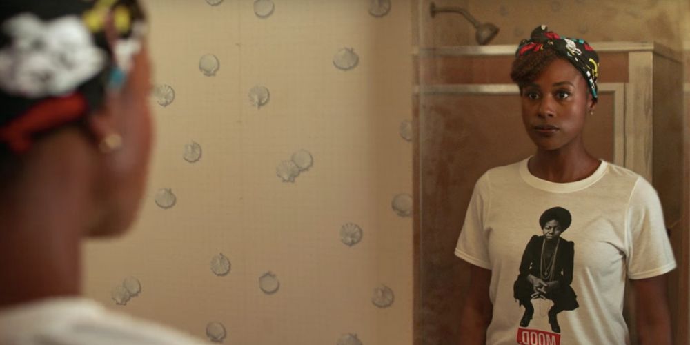 Issa raps in the mirror on Insecure