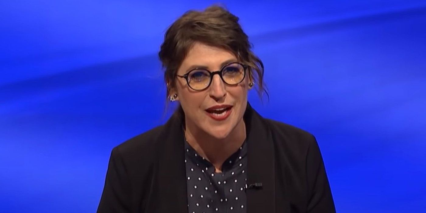Mayim Bialik with her hair up, mid sentence in Jeopardy!