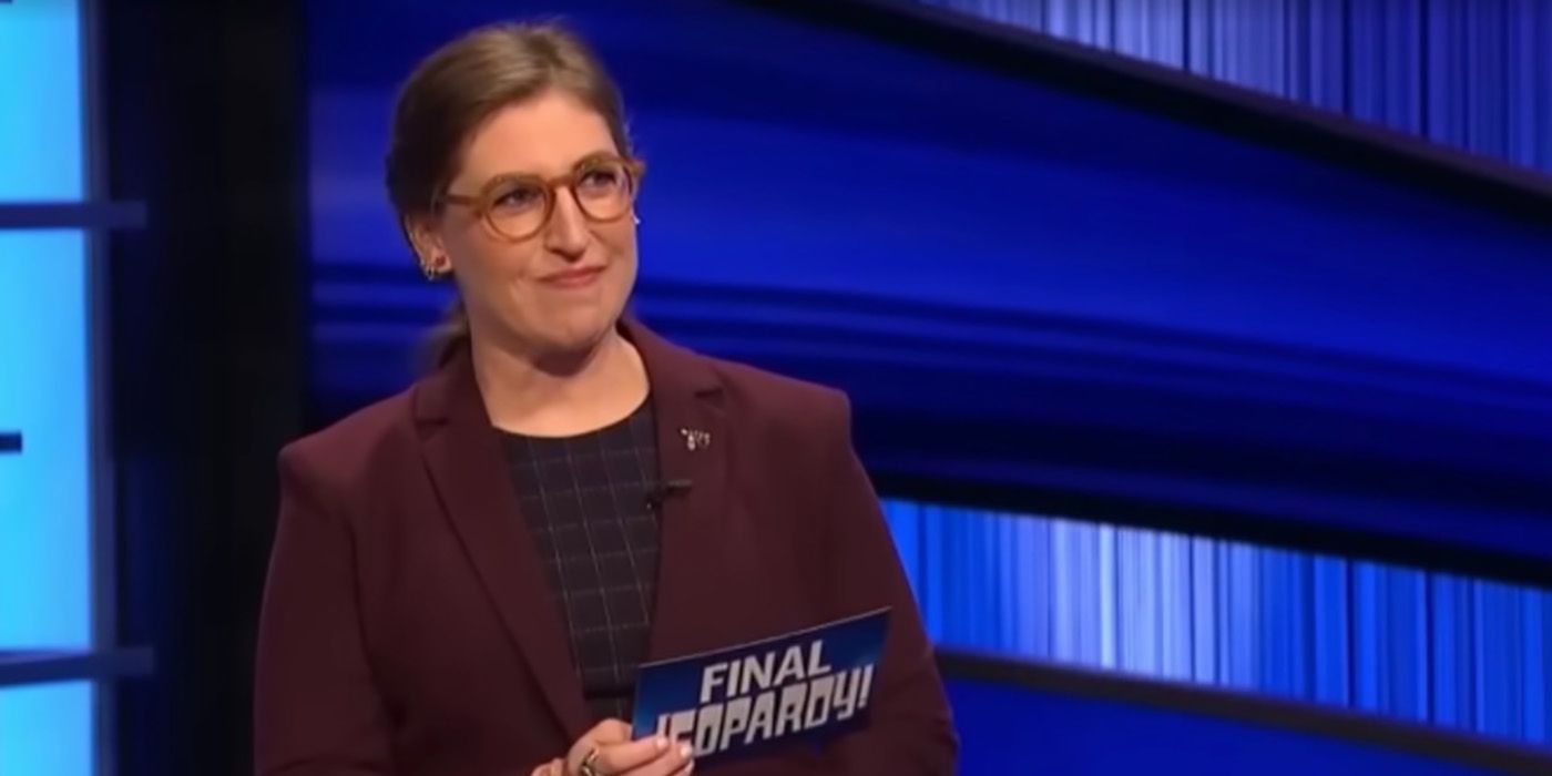 Mayim Bialik with her hair back as host of Jeopardy!