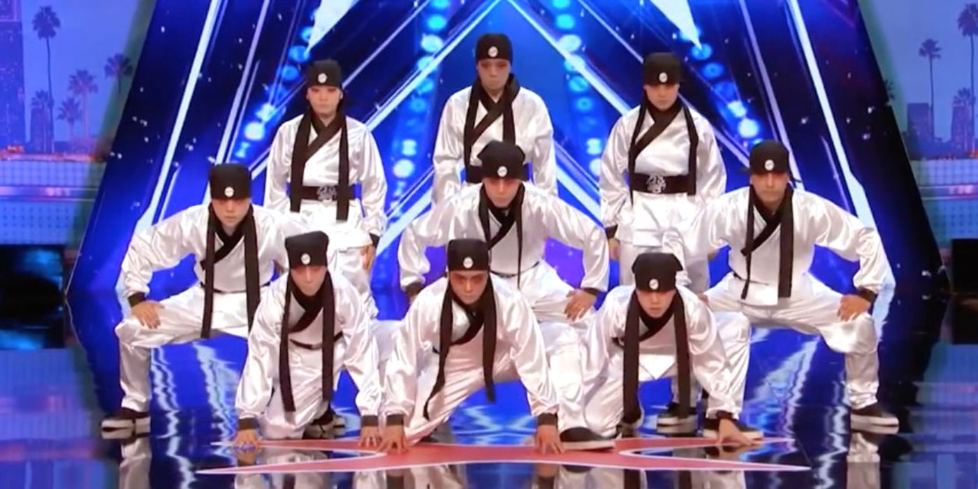 The members of the Just Jerk dance group posing on stage on AGT.