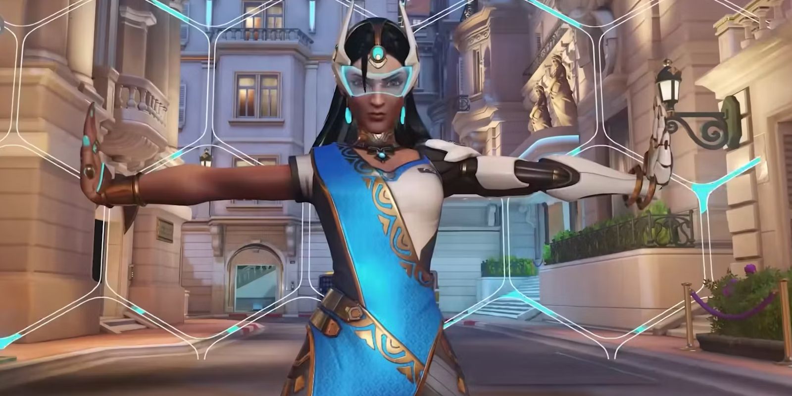 Symmetra standing in front of a barrier.as seen in Overwatch 2