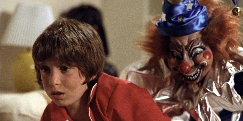 Robbie is attacked by the clown in Poltergeist