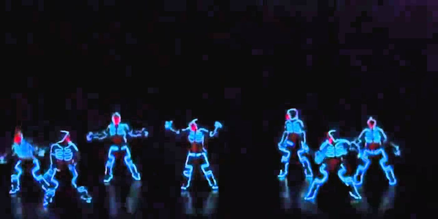 Team illuminate dancing on stage in blue lights on AGT.