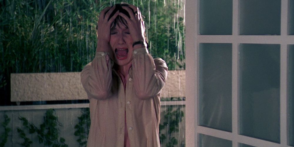 A woman screams in the rain in Tenebrae