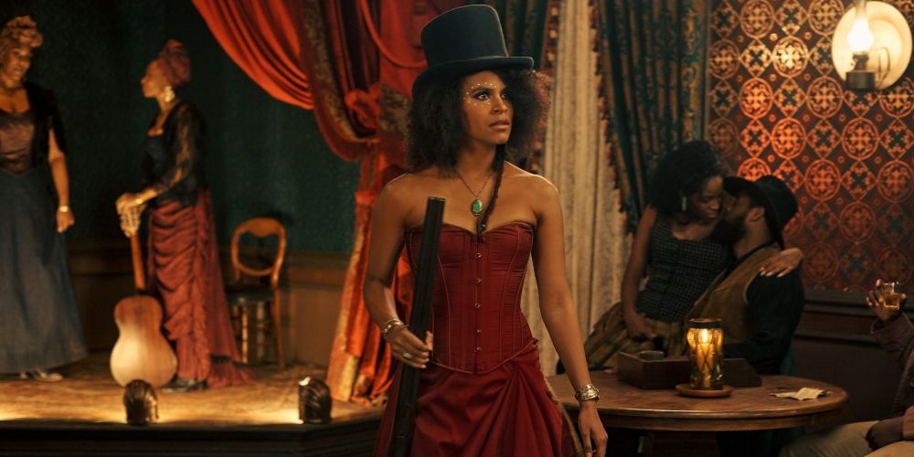 Mary holds a gun in the saloon in The Harder They Fall
