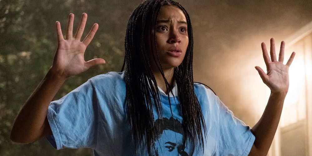 Starr holds up her arms in The Hate U Give