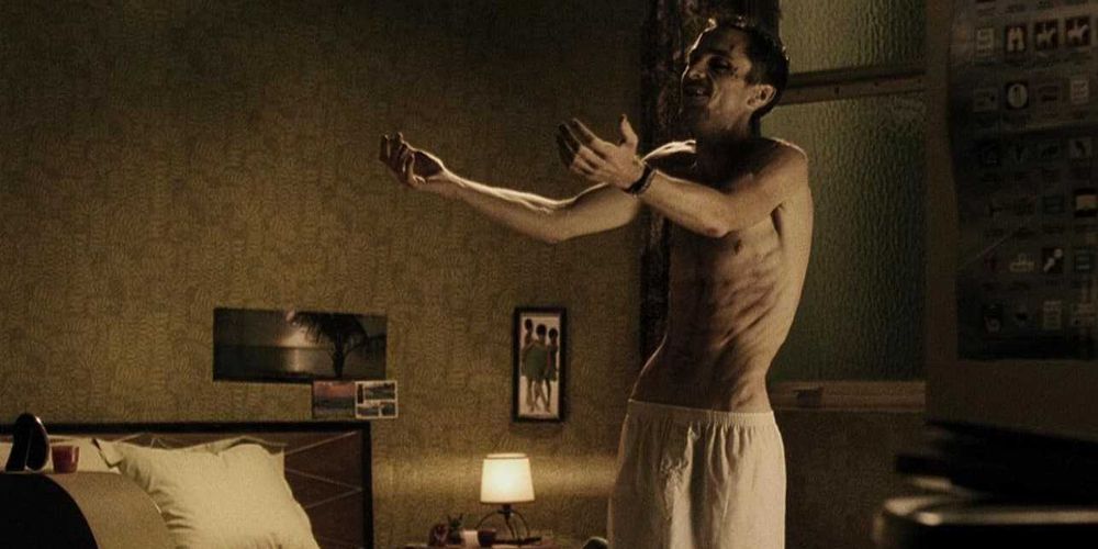 Trevor holds out his arms while in his underwear in The Machinist