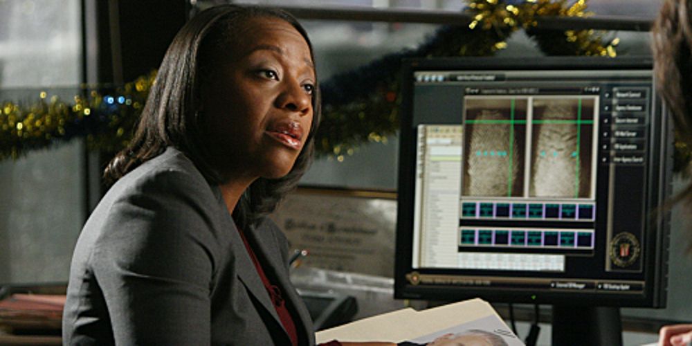 Viv sits at her desk in Without a Trace