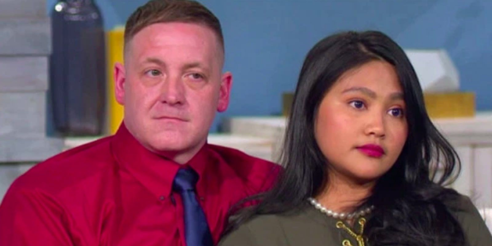 90 Day Fiancé Eric Rosenbrook Leida Margaretha sitting together on couch looking irritated