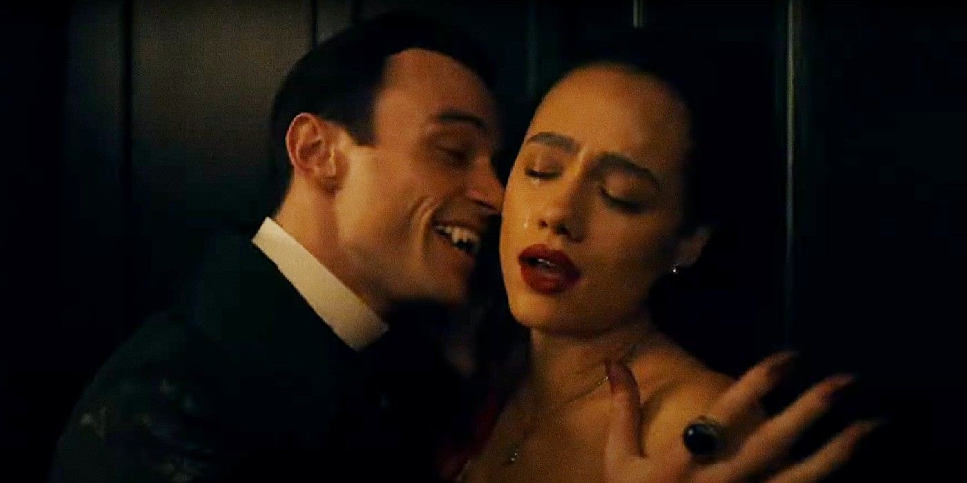 A vampire leans in to bite Nathalie Emmanuel's neck in The Invitation