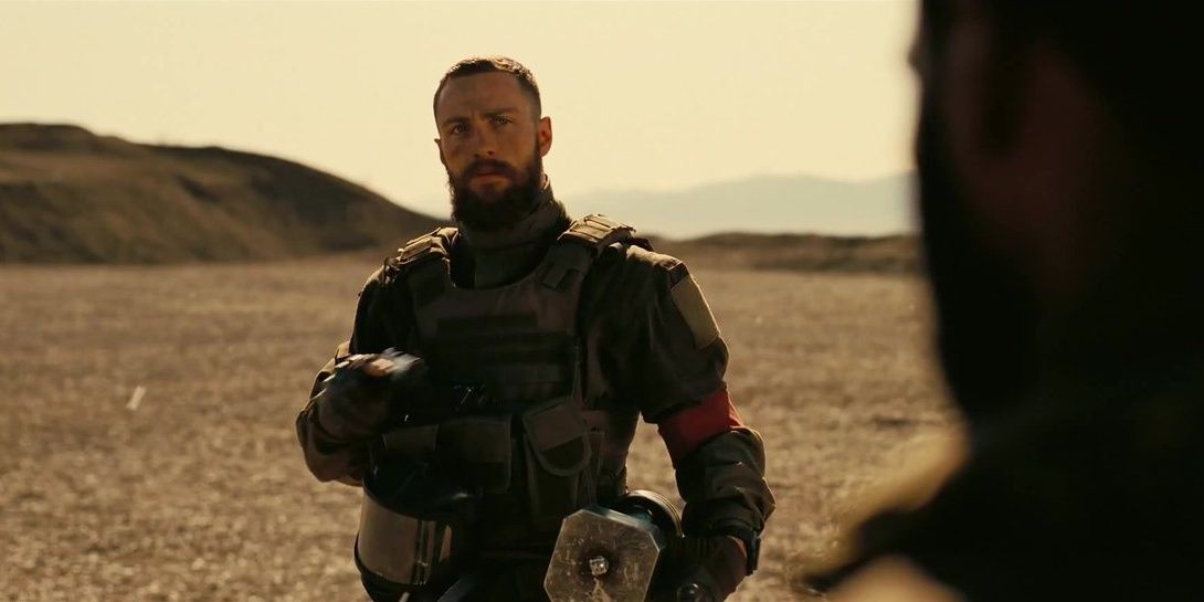 Aaron Taylor Johnson wearing an exo suit in Tent Cropped