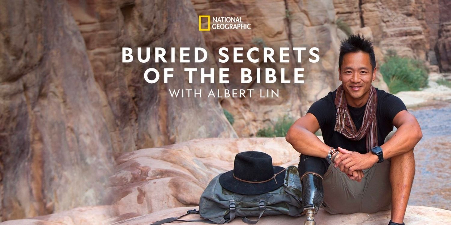 Albert Lin sitting on a rock in Buried Secrets of the Bible