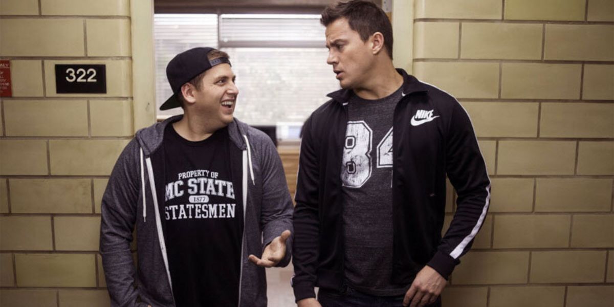 An image of Channing Tatum and Jonah Hill smiling at each other in 21 Jump Street