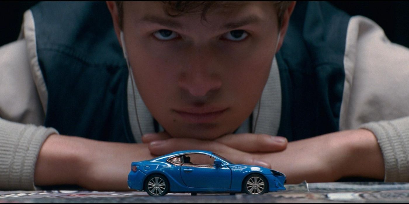 Baby (Ansel Elgort) staring at a toy car in Baby Driver