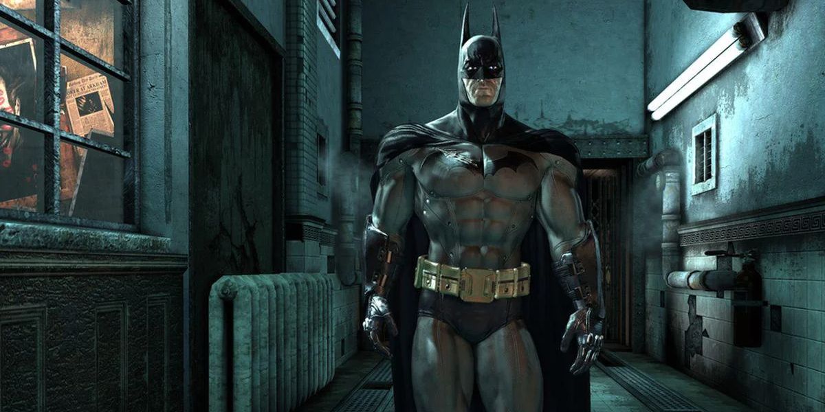 Batman looks on as he walks the halls of Arkham Asylum 