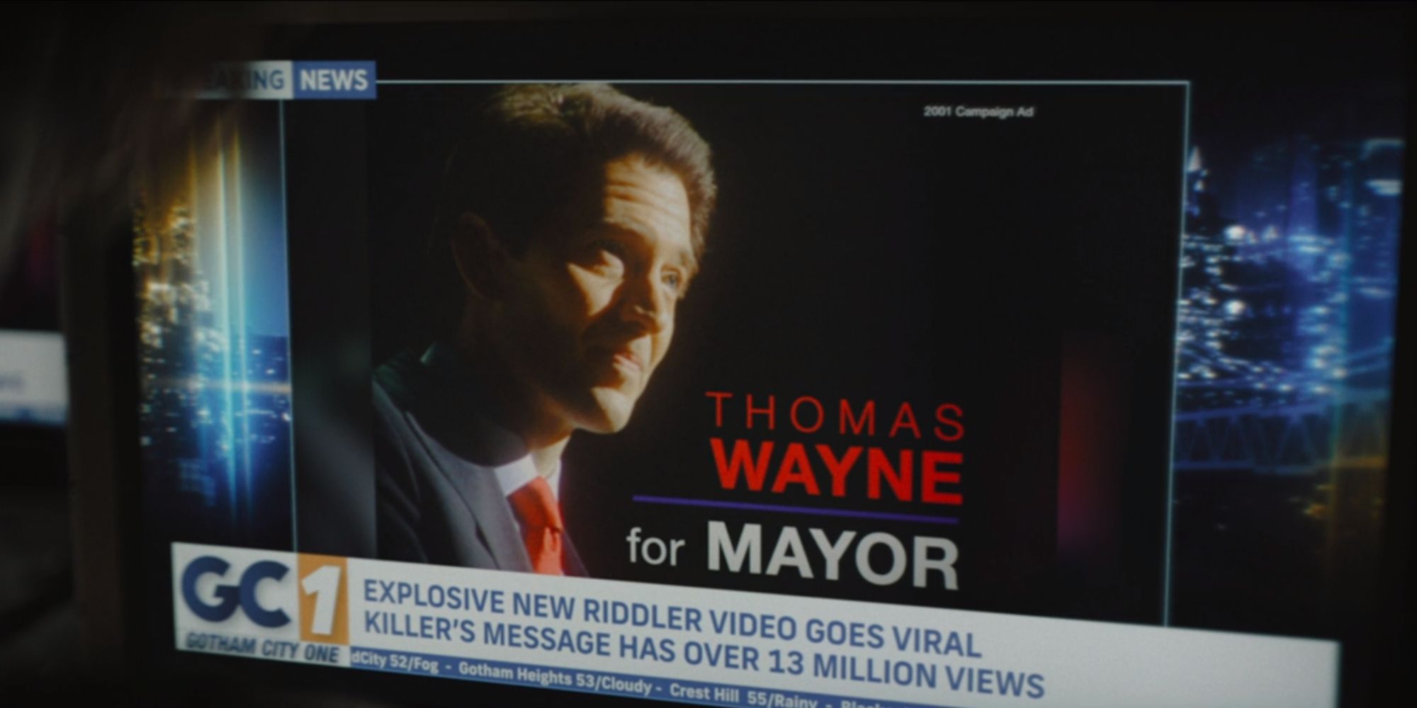 Batman watching the Riddler&rsquo;s video about Thomas Wayne in The Batman (2022)