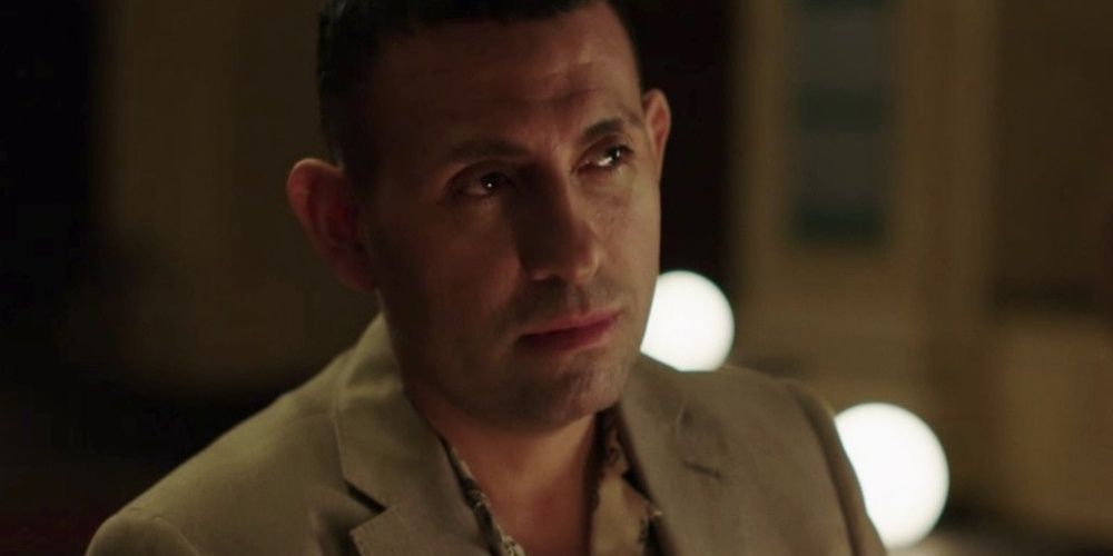 Bernardo Badillo looking up and smiling in Queen Of The South