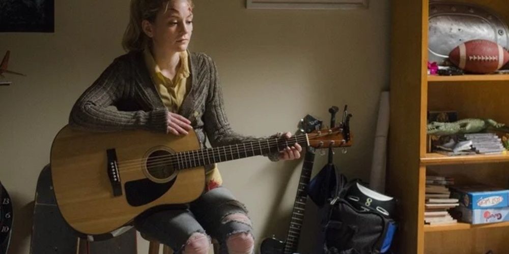 Beth playing the guitar in The Walking Dead 