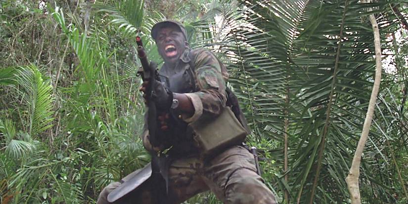 Bill Duke in Predator screaming and wildly firing his weapon