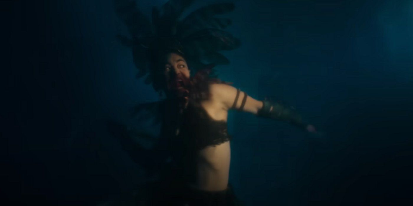 Namora throws a spear underwater