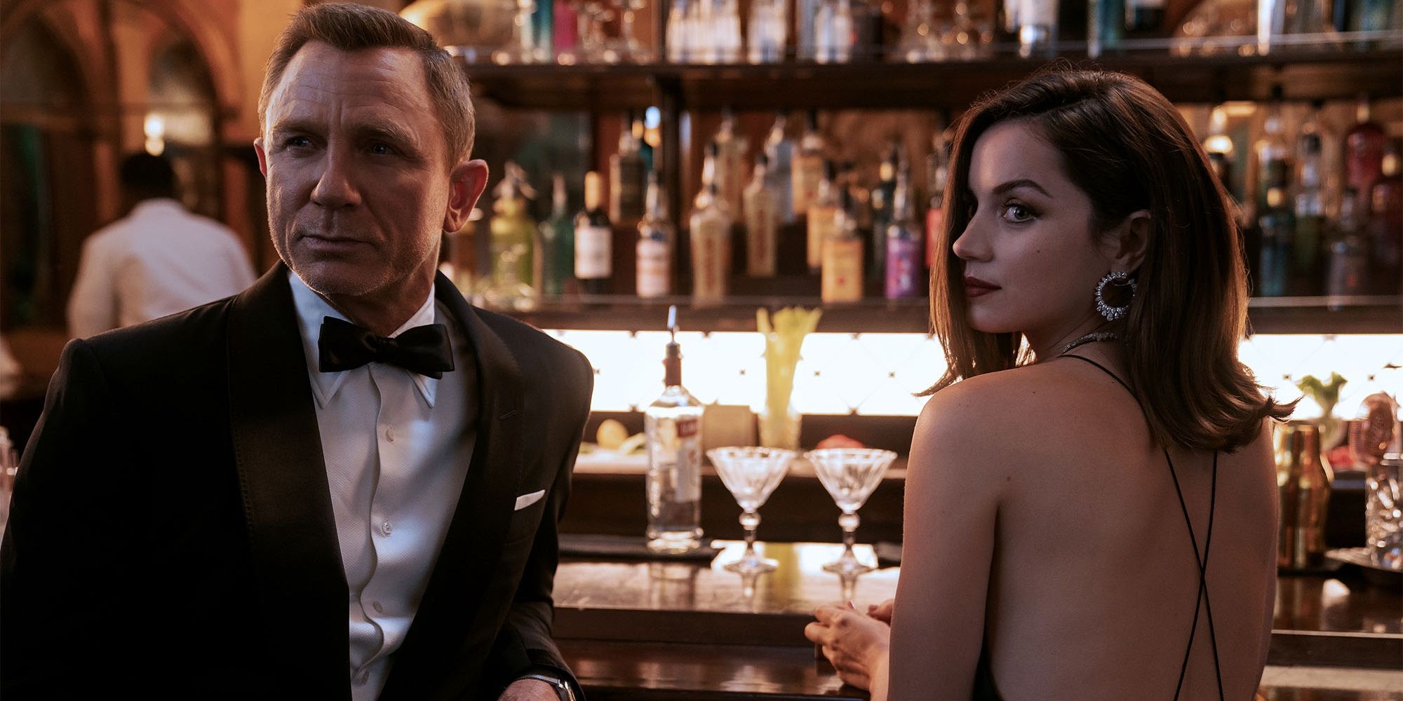 Bond and Paloma sit at a bar in No Time to Die
