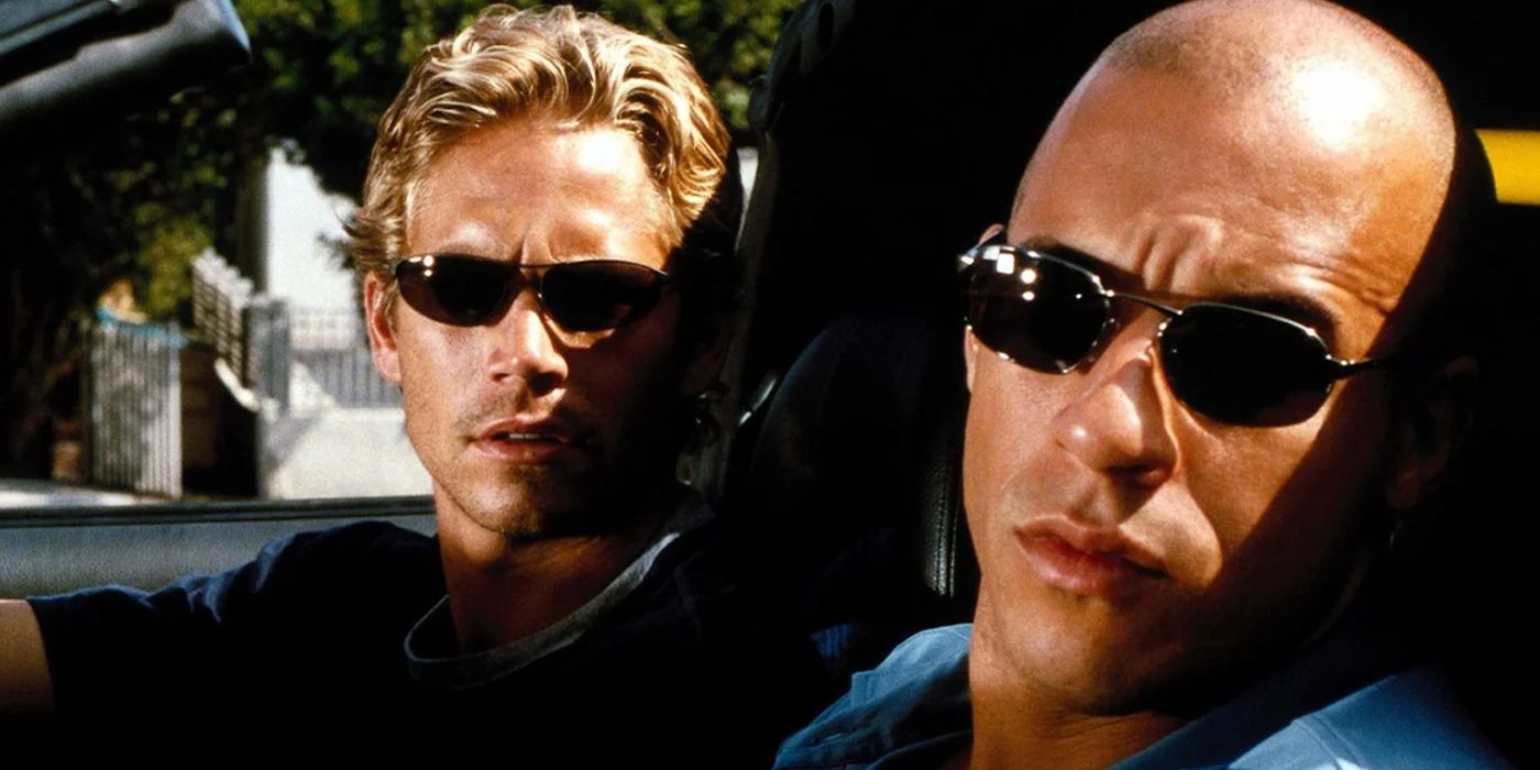 Brian and Toretto wearing sunglasses in a convertible in The Fast and the Furious