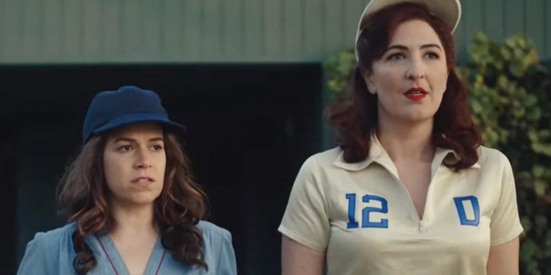 Carson and Greta on the baseball field in A League of Their Own