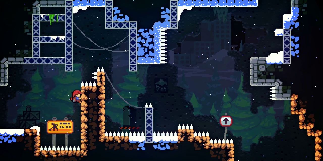 The hero attempts to navigate a treacherous level featuring spikes and pitfalls from Celeste