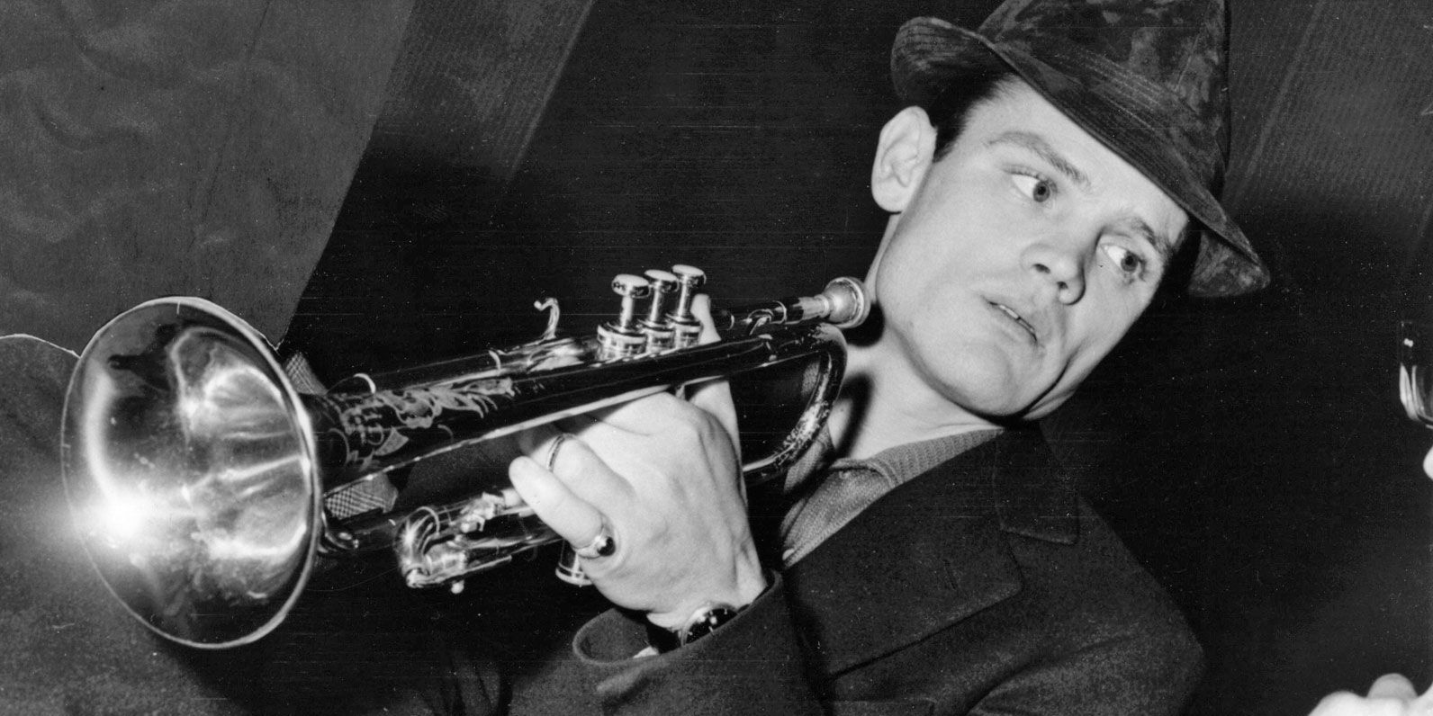 Chet Baker in 1962 playing a trumpet.
