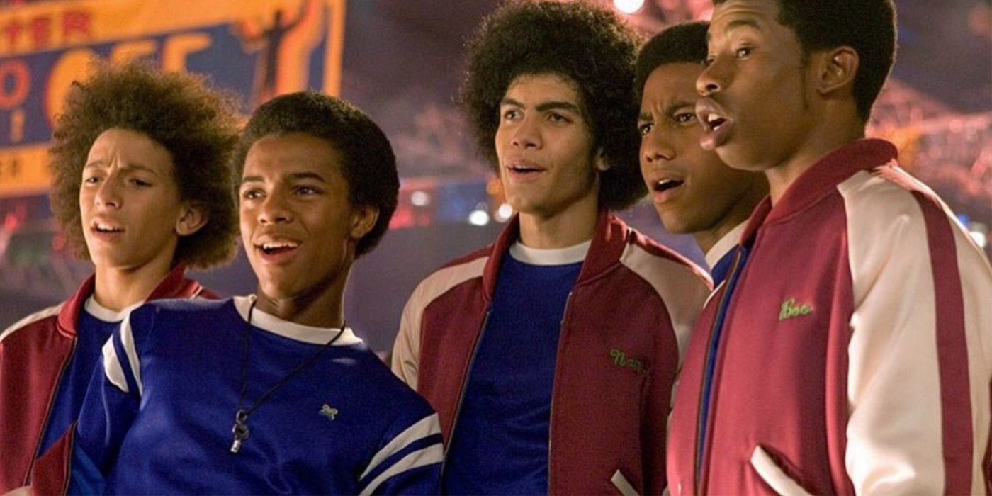 The guys standing at the roller rink in Roll Bounce.