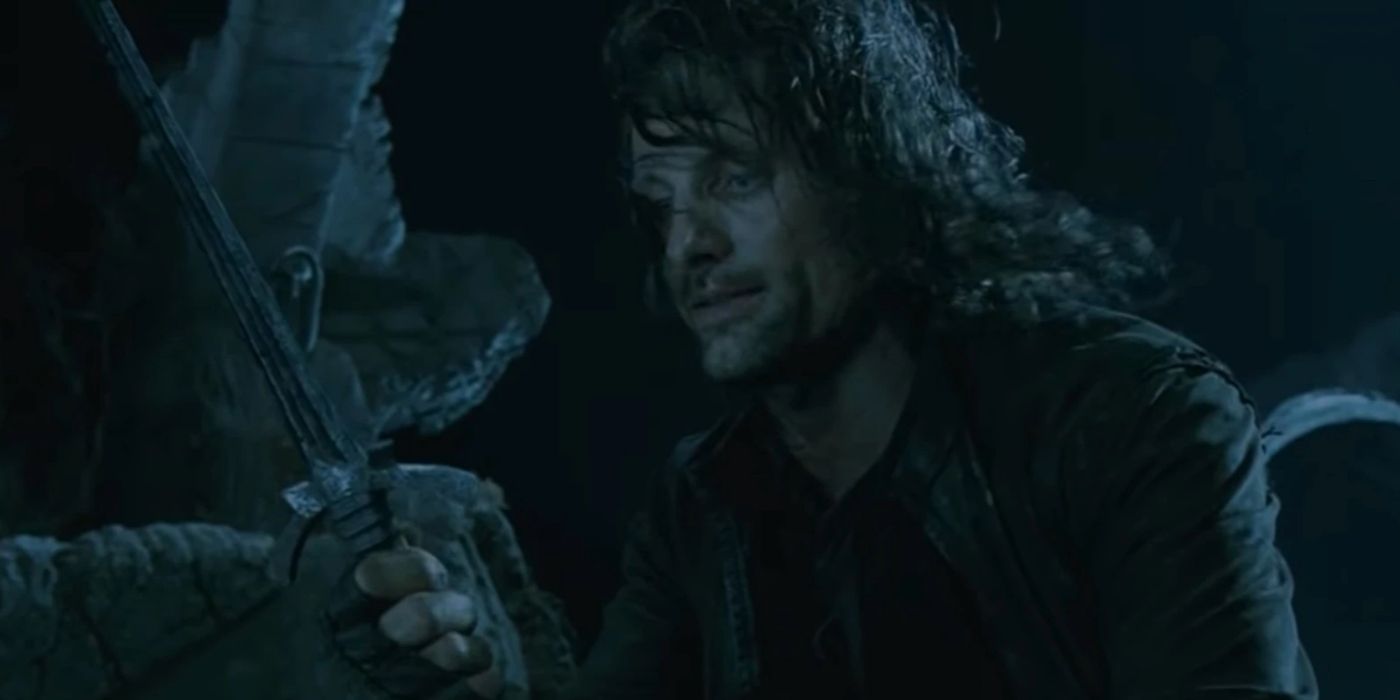 Aragorn holding the Morgul Blade in The Lord Of The Rings