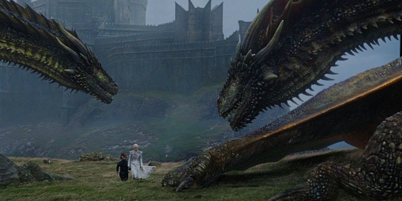 Daenerys and Tyrion walking among her Dragons in Game of Thrones.