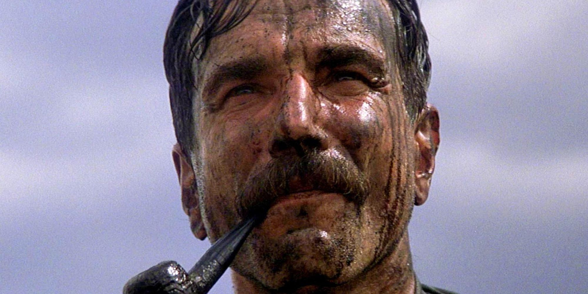 Daniel Plainview (Daniel Day-Lewis) covered in oil in There Will Be Blood.