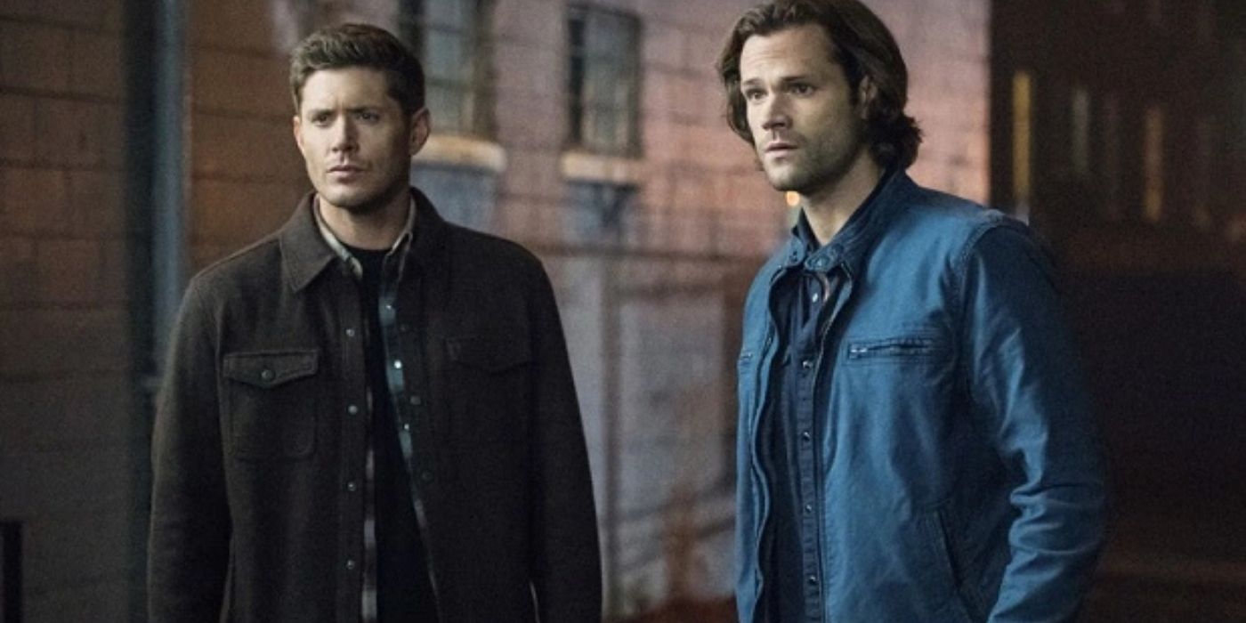 Dean and Sam standing together and looking serious on Supernatural