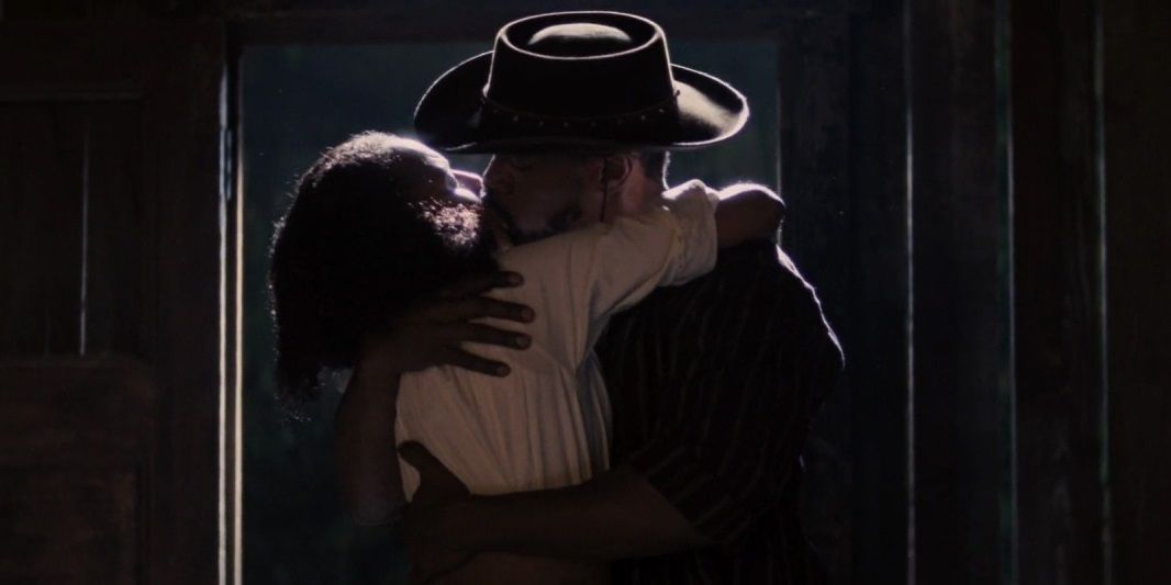 Django and Broomhilda embrace in Django Unchained