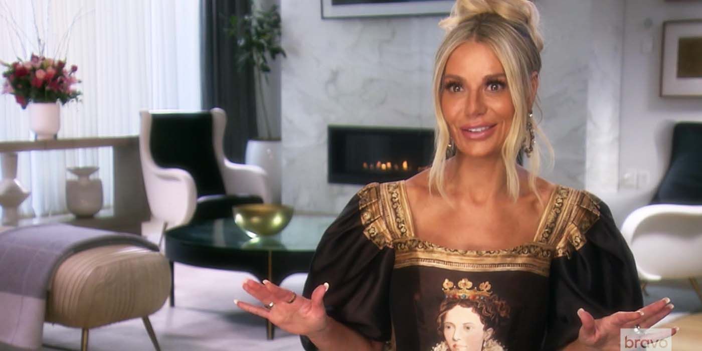 Dorit Kemsley in dress with queen motif, talking to cameras RHOBH The Real Housewives of Beverly Hills