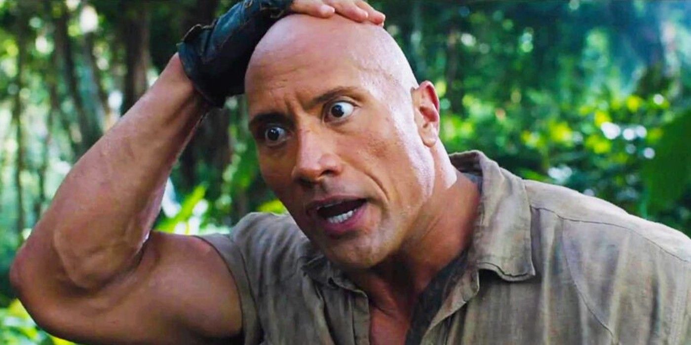 The Rock rubs his head in shock in Jumanji Welcome to the Jungle