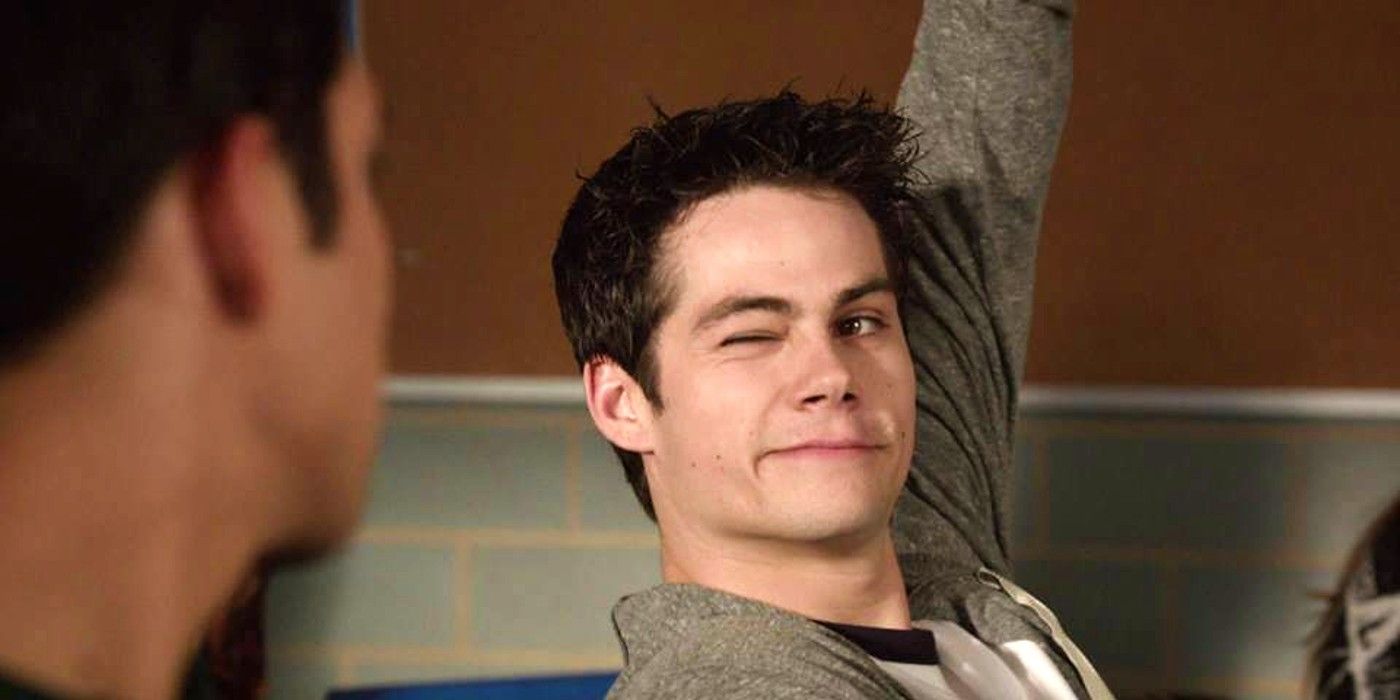 Dylan O'Brien  winking and raising his hand in Teen Wolf