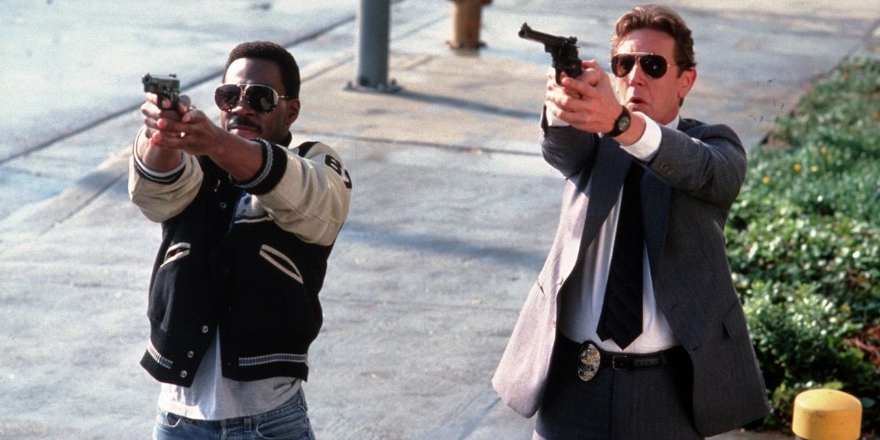 Eddie Murphy and Judge Reinhold with guns in Beverly Hills Cop II